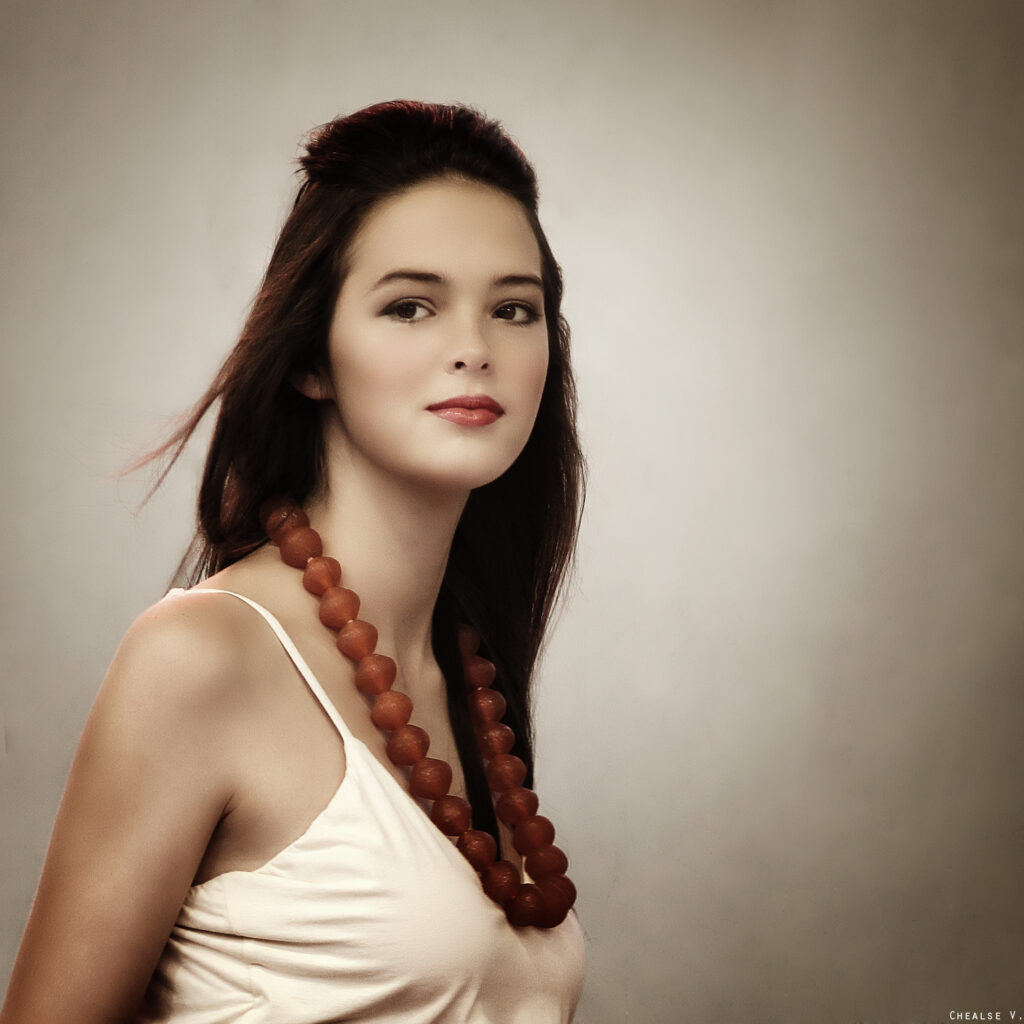 Ebony wearing Auralis jumpsuit and Sankofa beads