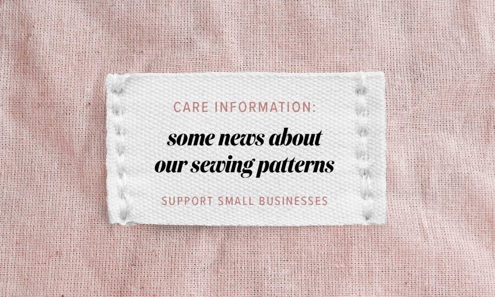 Clothing label says handmade on beige linen background